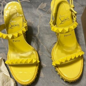 Yellow Christian loubitan sandals.
